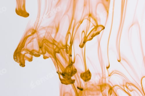Abstract Golden Swirls Against White Background
