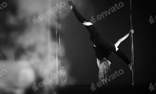 Preview: Girl Doing Exercises On A Sports Equipment. The Dancer On The Pylon In The Studio.