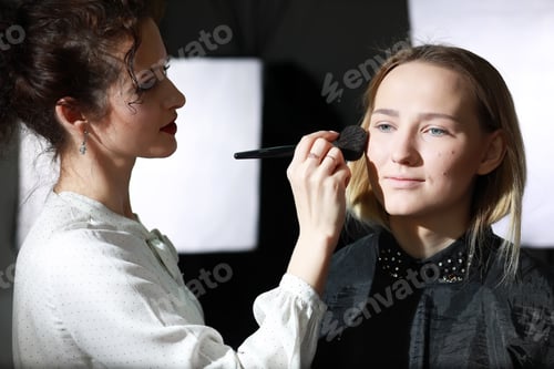 Preview: Young Girl With A Make-Up Artist In The Studio In Front Of A Mirror