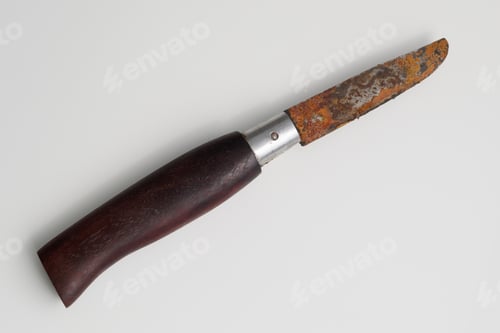 Preview: A Kitchen Knife With A Rusty Carbon Blade And A Wooden Handle.