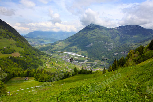 Preview: Hang Glider Pilot In Swiss Alps Taken In Summer,