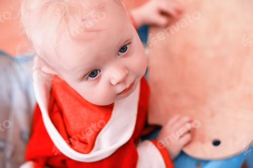 Preview: Portrait Of A Young Child With Blue Eyes In A Room