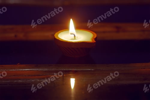 Preview: Candle In Clay Candlesttick On The Glass, Flame Reflecting