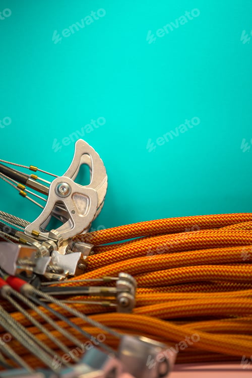 Preview: Climbing Equipment Folded On An Orange Rope. Modern Equipment For Climbing In The Mountains