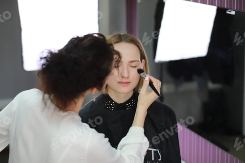 Preview: Young Girl With A Make-Up Artist In The Studio In Front Of A Mirror