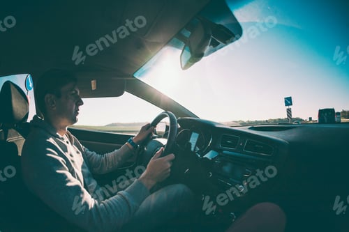 Preview: A Man Driving A Car. The Driver Drives The Vehicle. Travelling By Car.