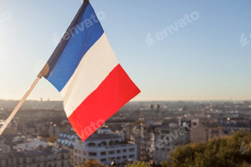 Preview: The Flag Of France On Background Of The View Of Paris From Sacre Coeur Basilica In France In Sunset