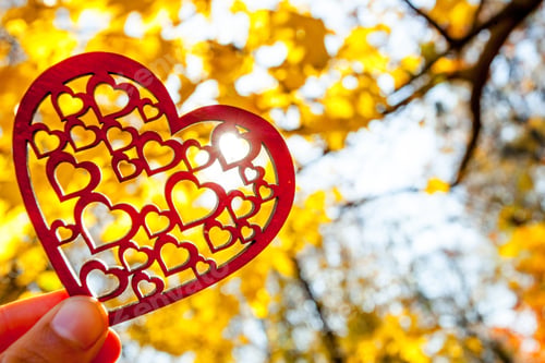 Preview: Red Heart On The Autumn Yellow Trees And Sky Background