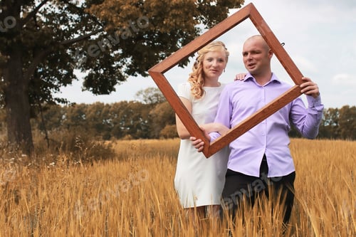 Preview: Just Married Lovers Walking In Field In Autumn Day