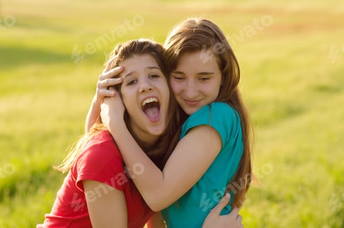 Preview: Two Teenage Girls Having Fun In The Nature On Sunny Summer Day.