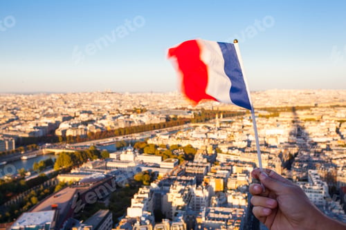 Preview: The Flag Of France Over The Paris City Top View From Eiffel Tower At Sunset Time