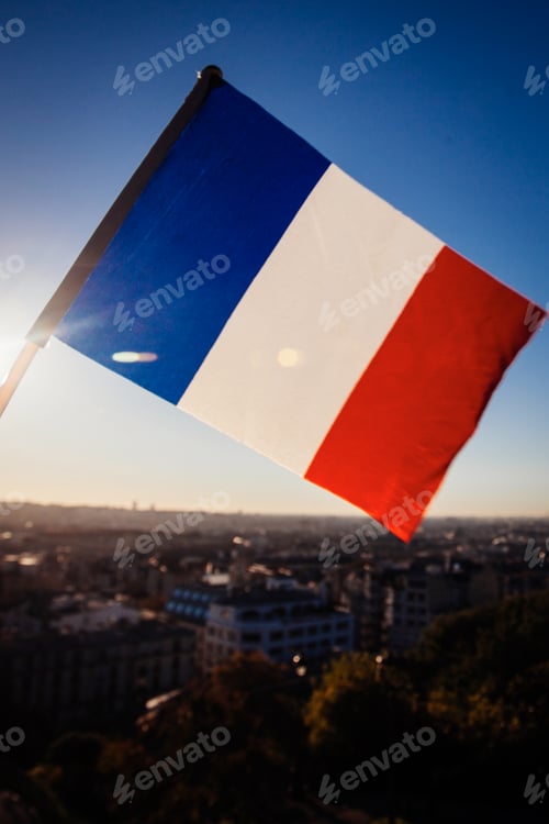 Preview: The Flag Of France On Background Of The View Of Paris From Sacre Coeur Basilica In France In Sunset