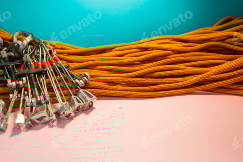 Preview: Climbing Equipment Folded On An Orange Rope. Modern Equipment For Climbing In The Mountains