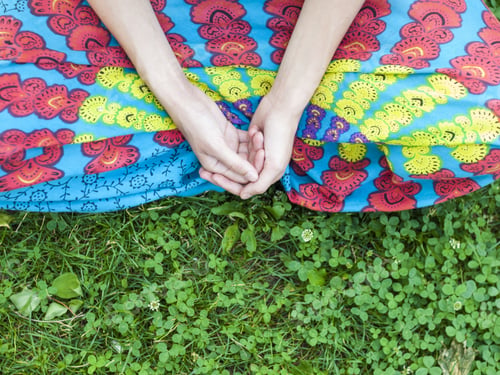 Preview: Hands Of A Young Girl Who Is Sitting On The Grass.