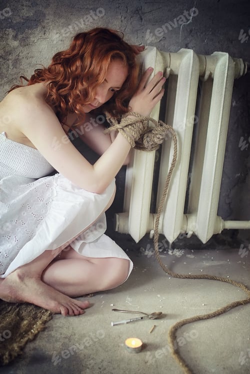 Preview: Young Girl Tied Up On The Floor. The Abducted Girl. The Victim Of Violence Sits On Floor With Tied