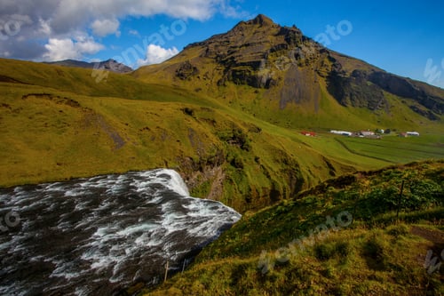 Preview: Skogafoss Waterfall And Raibow In Sunny Day In Iceland