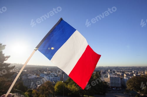 Preview: The Flag Of France On Background Of The View Of Paris From Sacre Coeur Basilica In France In Sunset