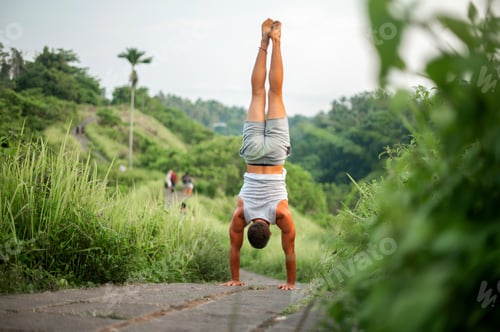 Preview: Man Practice Yoga Practice And Meditation Outdoor.