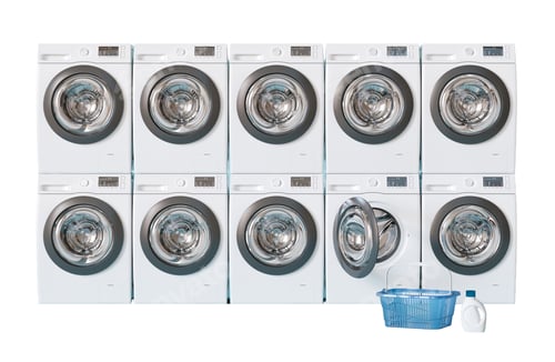 Preview: A row of washing machines in a public laundry. A blue basket sits next to one of the machines, and a