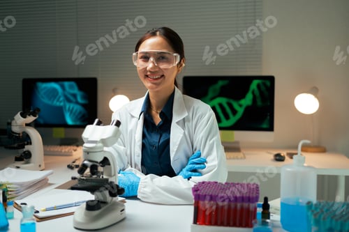 Preview: Female Asian scientist smiling in genetics laboratory