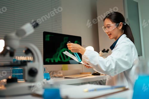 Preview: Asian scientist analyzing DNA in research laboratory