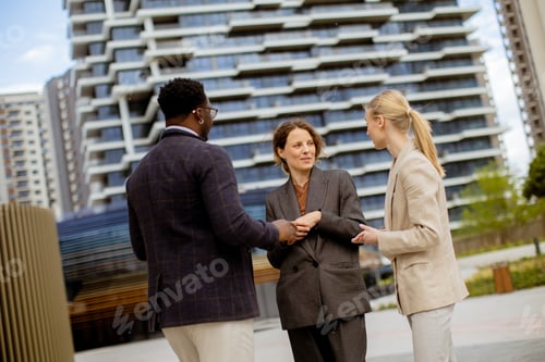 Preview: Group discusses ideas in modern urban setting during a sunny business day
