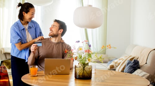 Preview: Couple prepares for online shopping at home during daytime