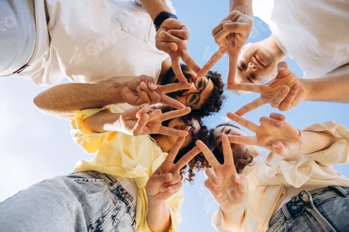 Preview: Group of friends showing peace signs forming a star