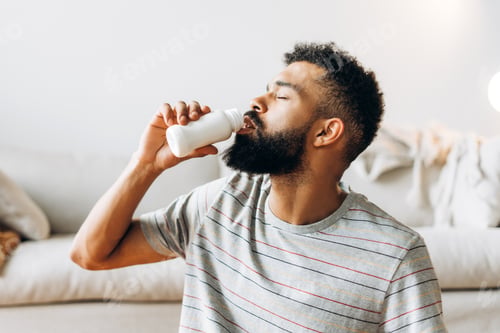 Preview: Man drinking probiotic yogurt for healthy lifestyle