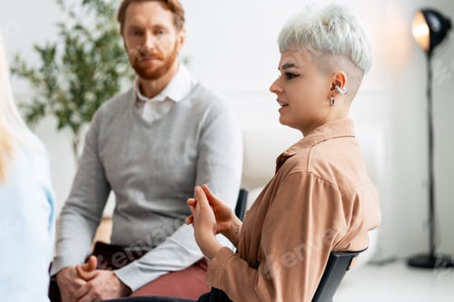 Preview: Diverse people sharing feelings during emotional support group meeting