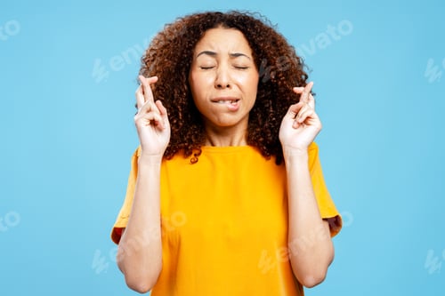 Preview: Woman crossing fingers wishing hoping for good luck