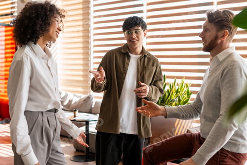Preview: Diverse team collaborating, communicating, and discussing ideas in modern office