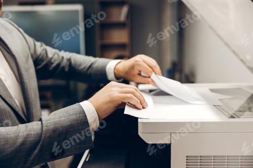 Preview: Professional man using office photocopier for scanning documents