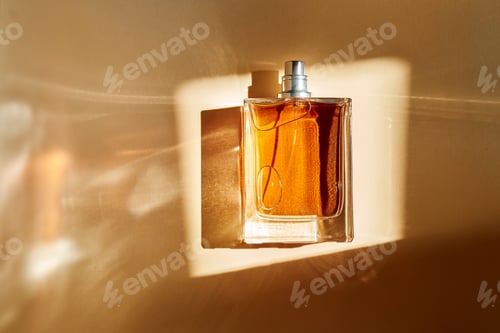 Preview: Perfume bottle capturing sunlight with amber liquid and elegant reflections