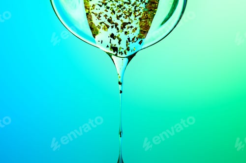 Preview: Biotech serum fluid dripping with gold flakes