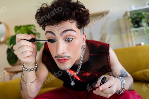 Preview: Person applying mascara to create a bold look