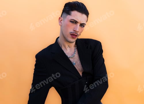 Preview: Young person expressing androgynous style with makeup and blazer