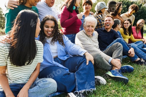 Preview: Group of multiracial friends of different ages having fun together outdoor
