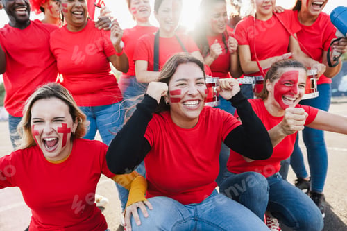 Preview: Multiracial red sport fans screaming while supporting their team