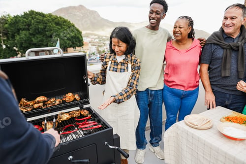 Preview: Happy Group of Friends Enjoying a Rooftop Barbecue Together