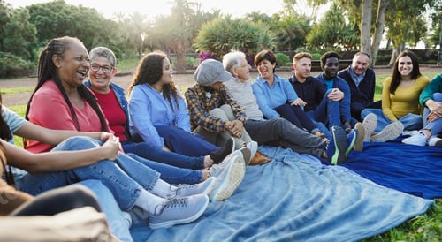 Preview: Group of multigenerational people having fun at city park