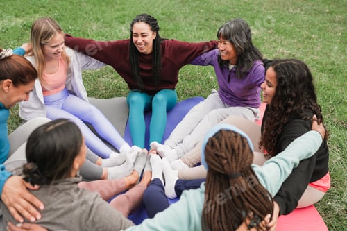 Preview: Women's circle during a group yoga class with people of different age and body types