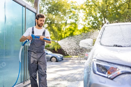 Preview: Man Washing Car with Pressure Washer