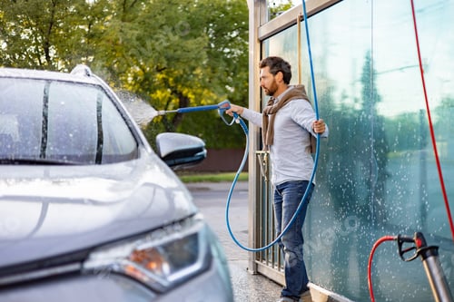 Preview: Man Washing Car With Pressure Washer