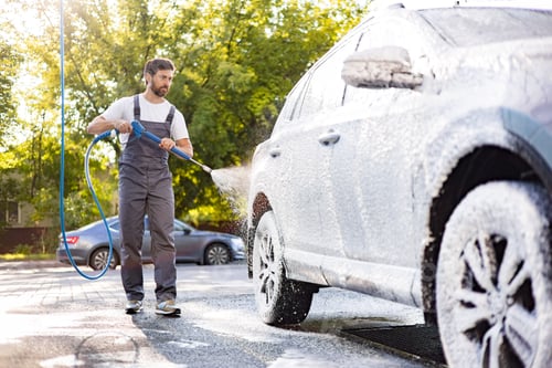 Preview: Man Washing Car With Pressure Washer