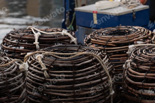 Preview: Traditional wicker crayfish traps stacked on commercial fishing boat deck