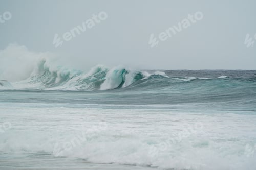 Preview: Powerful surf break large breaking waves under overcast sky