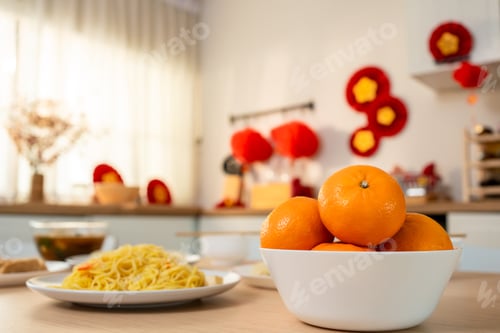 Preview: Table filled with traditional Lunar New Year food on table in cozy room.