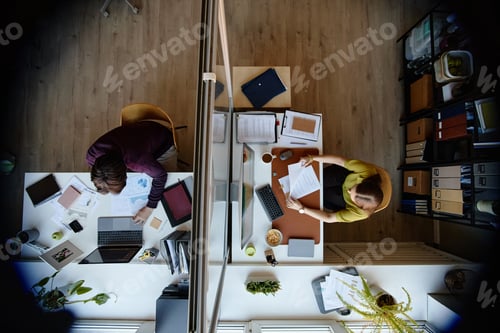 Preview: Businesswomen Working at Separate Desks in Modern Office