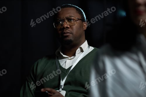 Preview: Black Man Listening during Business Meeting or Training Session